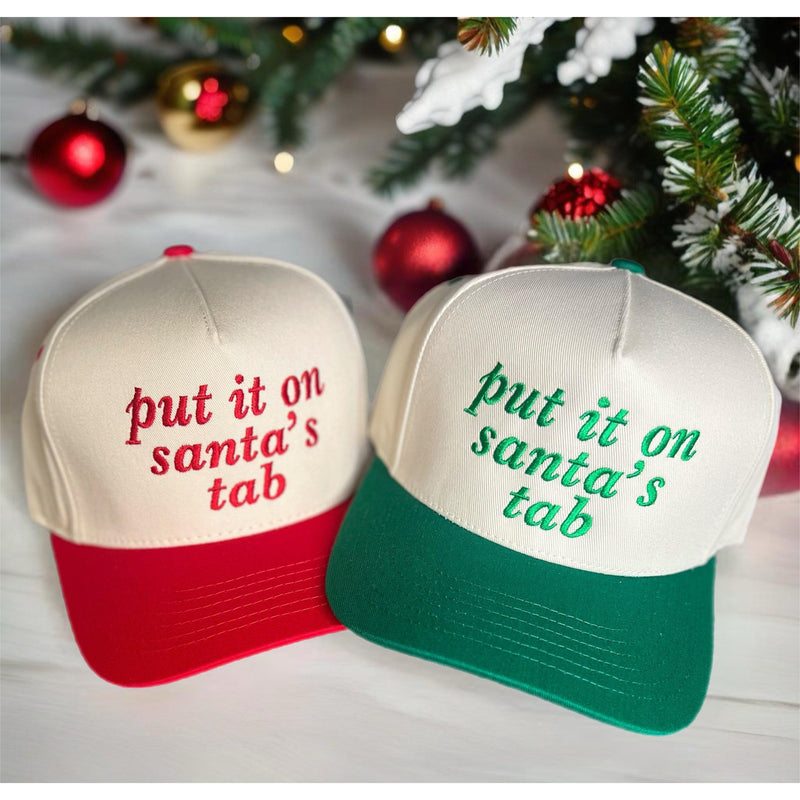 Put it on Santa's Tab Trucker Hat (Red or Green)